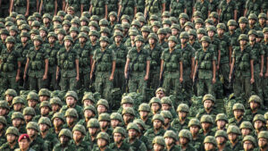 Chinese troops in formation and in camouflage fatigues