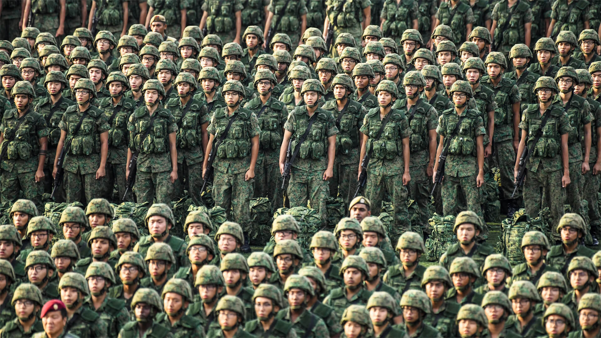 Chinese troops in formation and in camouflage fatigues
