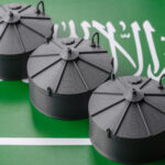 Miniature Industrial Oil Tanks on Saudi Arabian Flag | Licensed by Envato Elements
