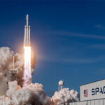SpaceX rocket launching from a pad