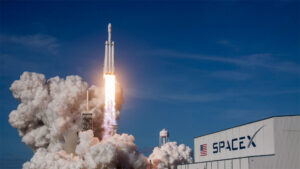 SpaceX rocket launching from a pad