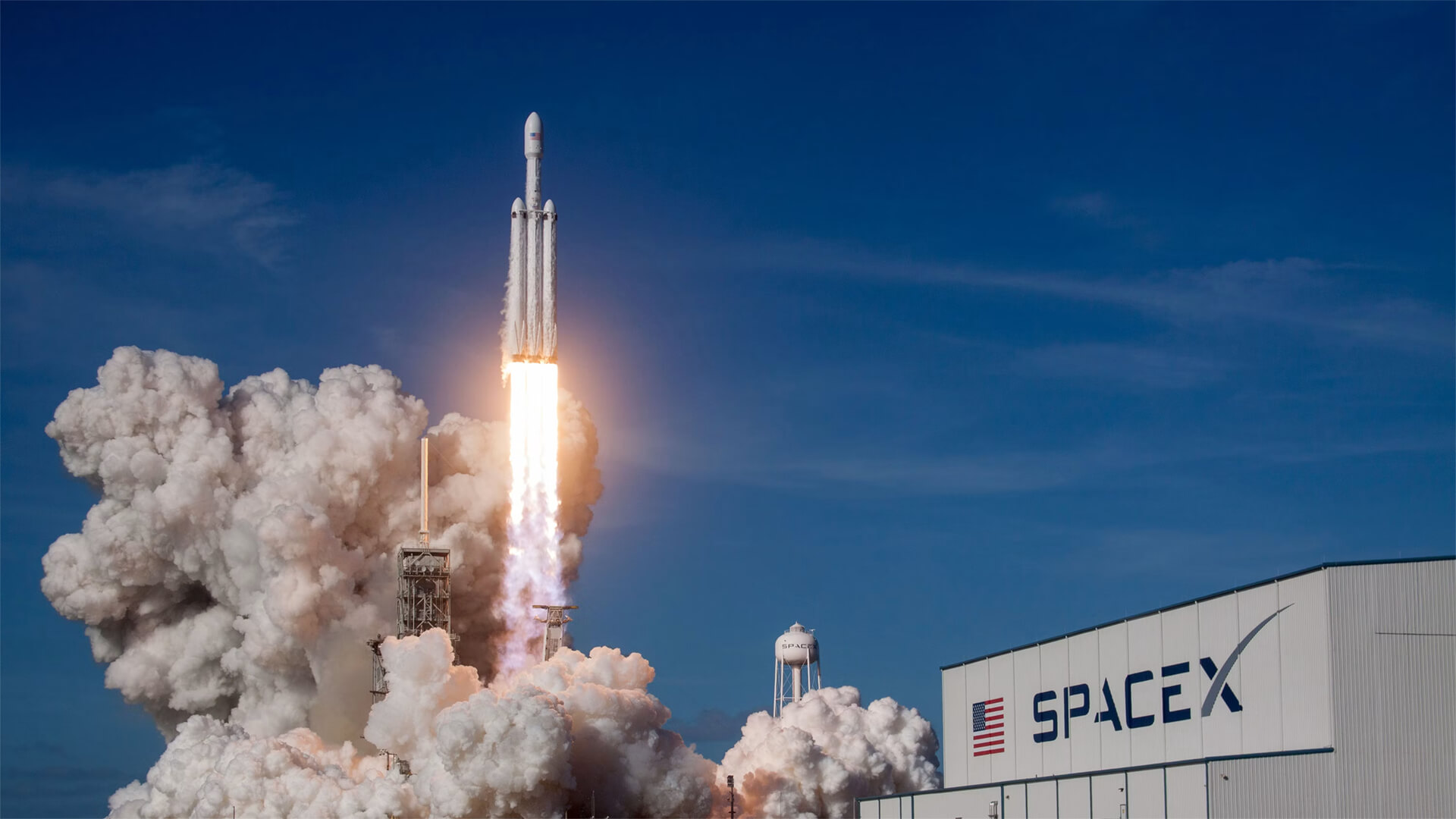 SpaceX rocket launching from a pad